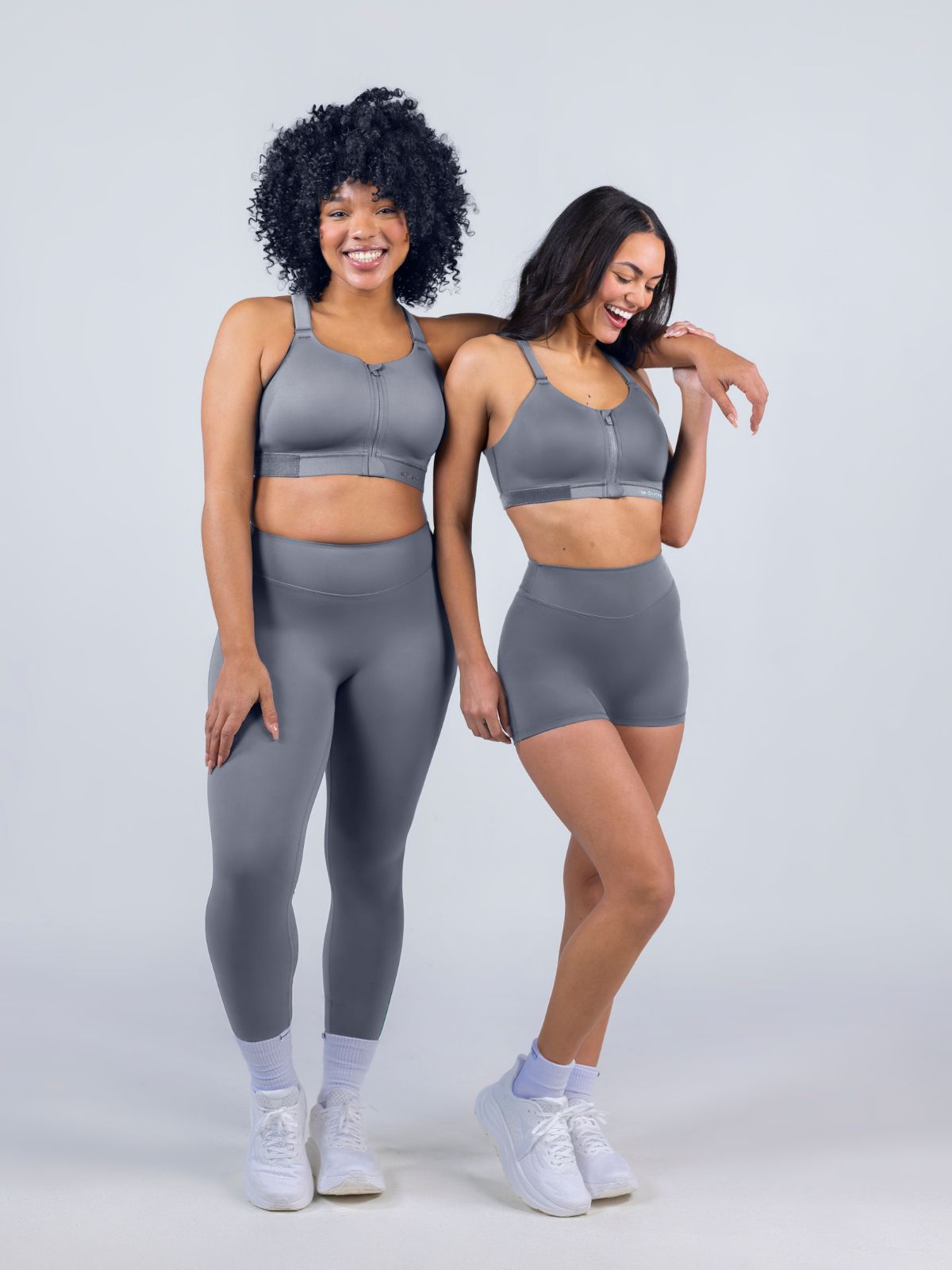Women wearing SHEFIT performance bottoms