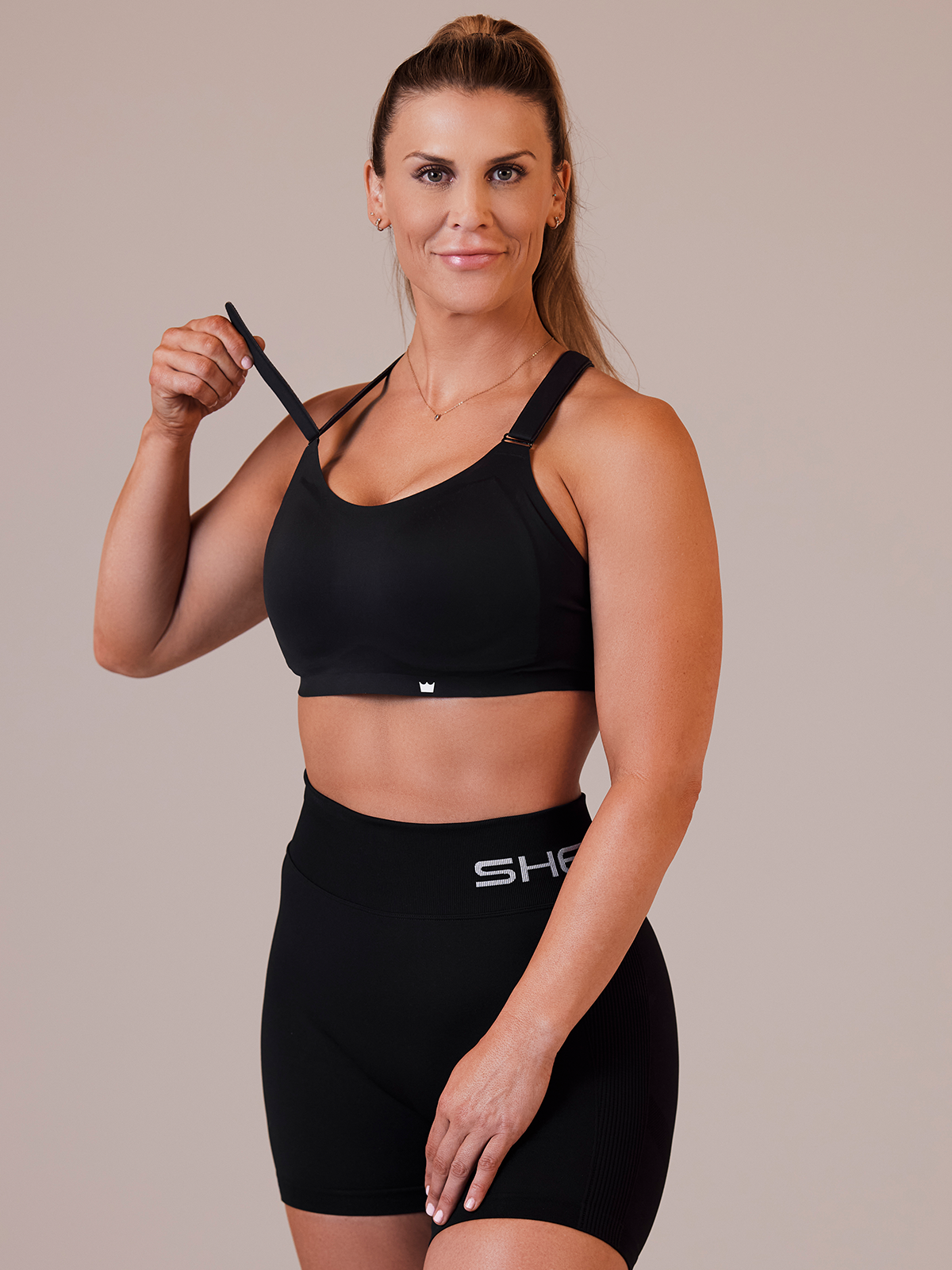 Black SHEFIT® Flex Sports Bra. The Support and Fit like no other. 