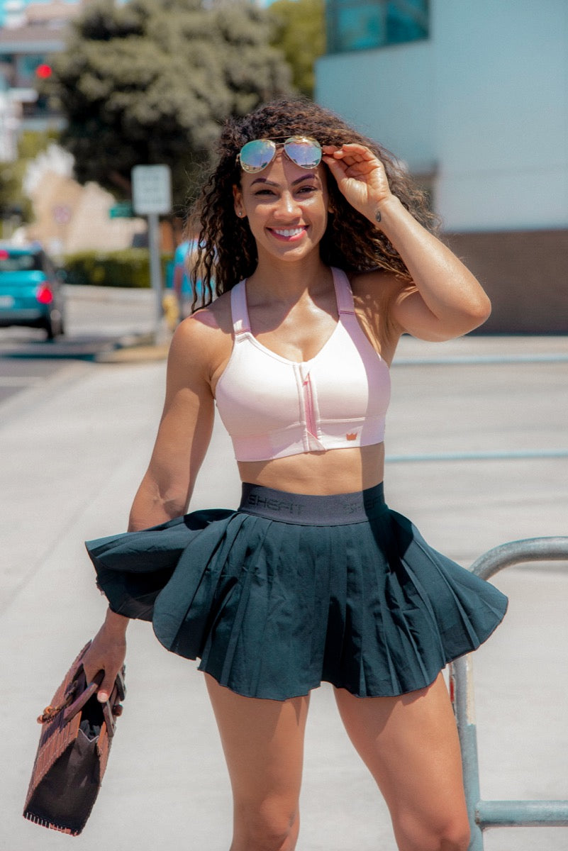Creator wearing SHEFIT with a tennis skirt outdoors